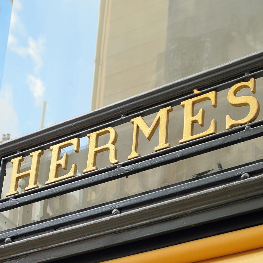 A picture of the Hermès logo on the store front on Rue Du Faubourg St in Paris, France